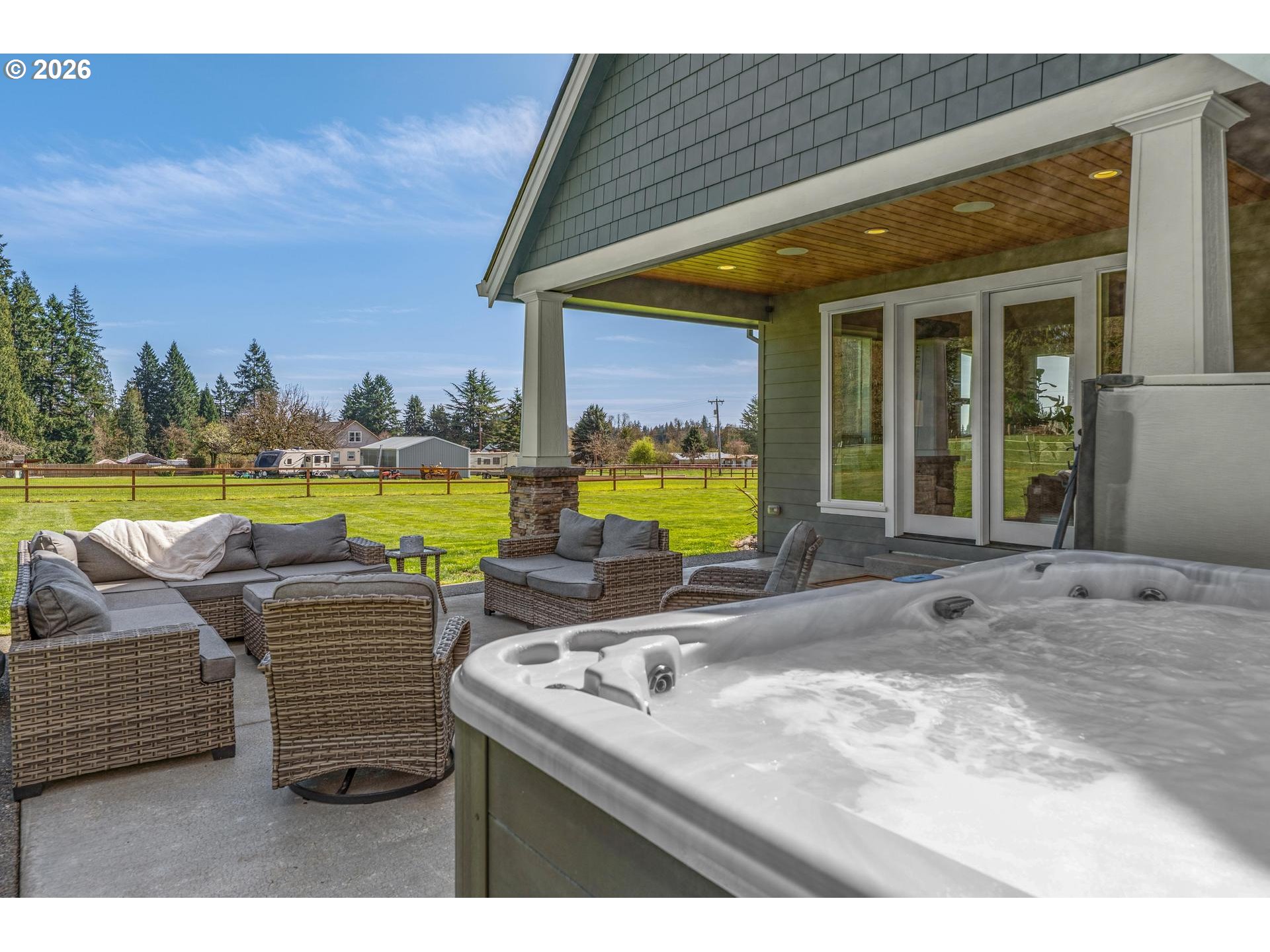 34281 Millard Road Warren, OR 97053 - Photo 43 of 47 a view of a house with a swimming pool and a back yard