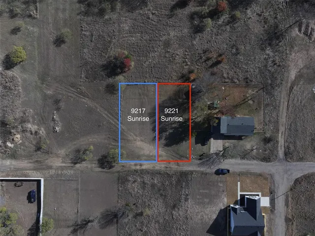 an aerial view of a town with ocean