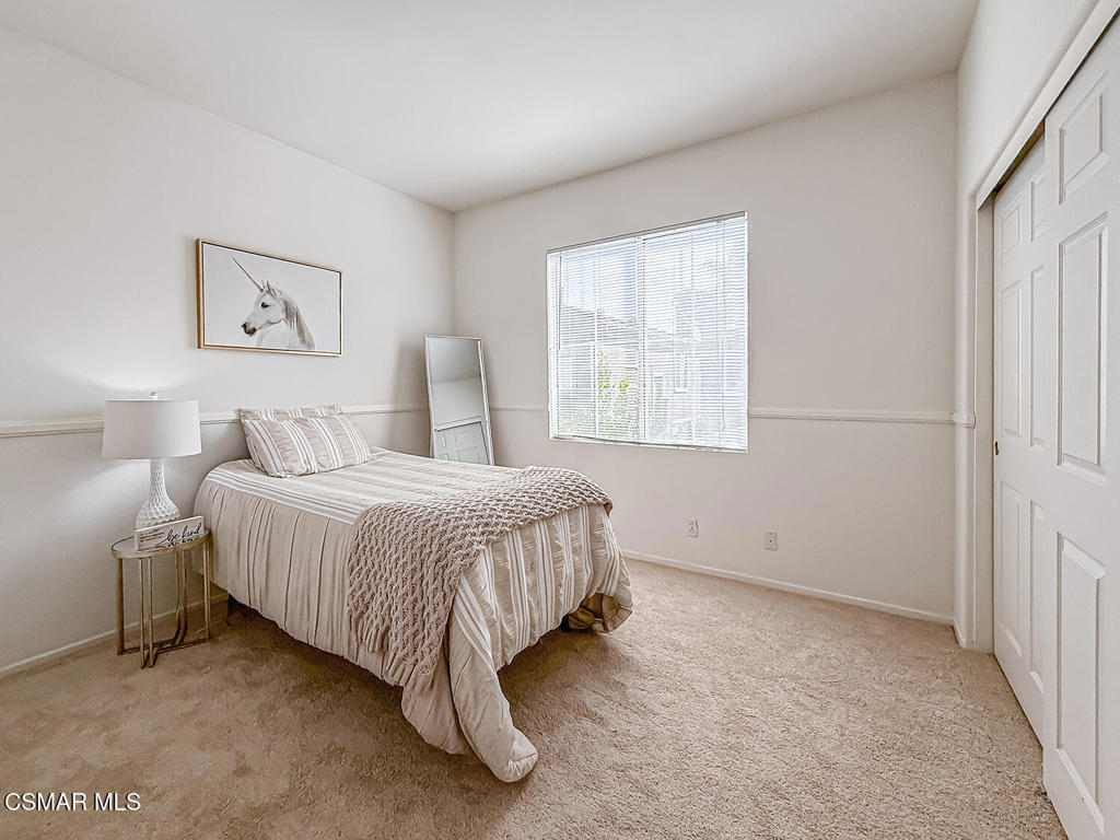 4030 Villamonte Court Camarillo, CA 93010 - Photo 22 of 42 a spacious bedroom with a bed and a window