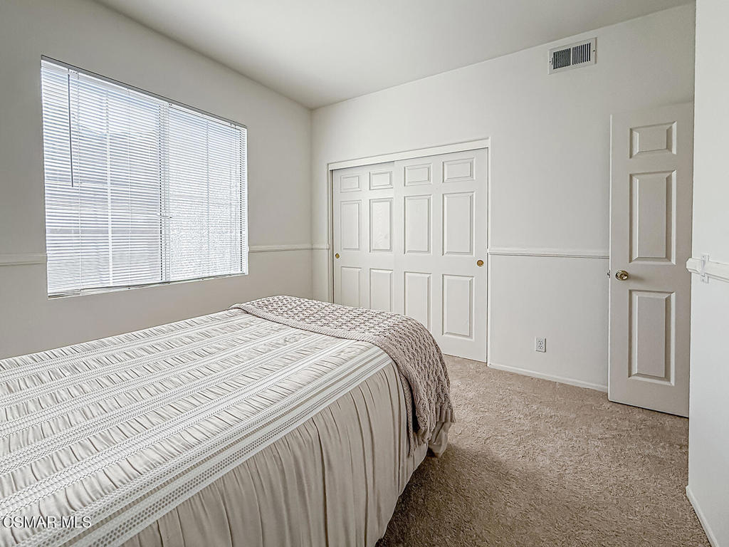 4030 Villamonte Court Camarillo, CA 93010 - Photo 23 of 42 a bedroom with a bed and a window