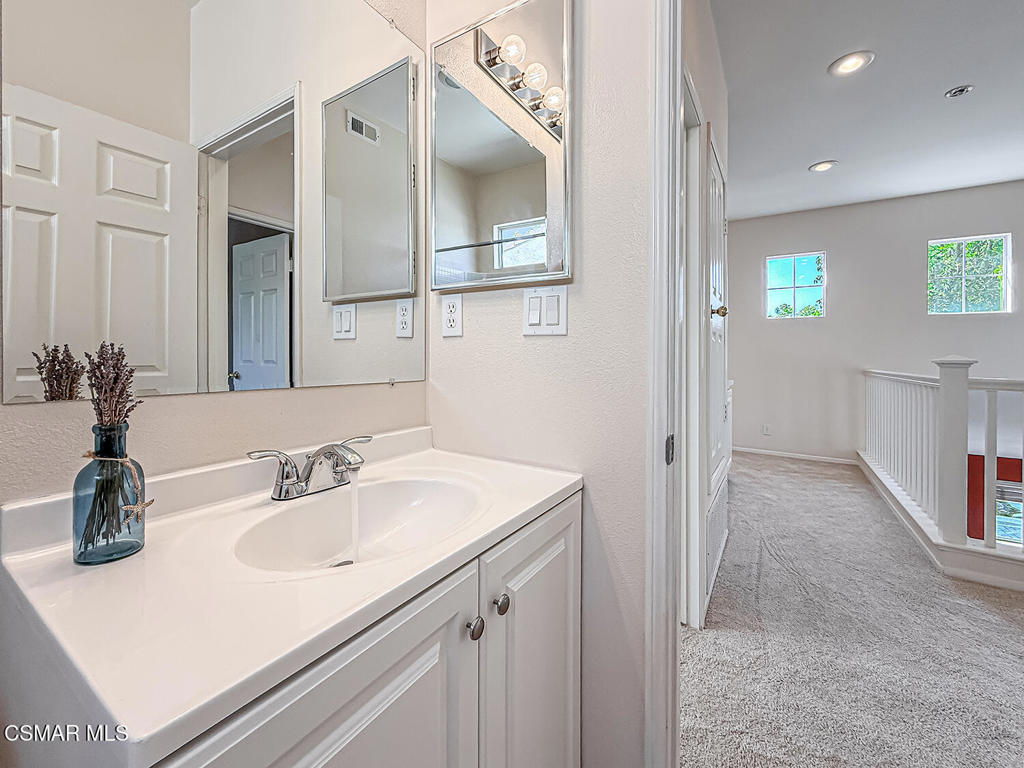 4030 Villamonte Court Camarillo, CA 93010 - Photo 25 of 42 a bathroom with a sink and a mirror