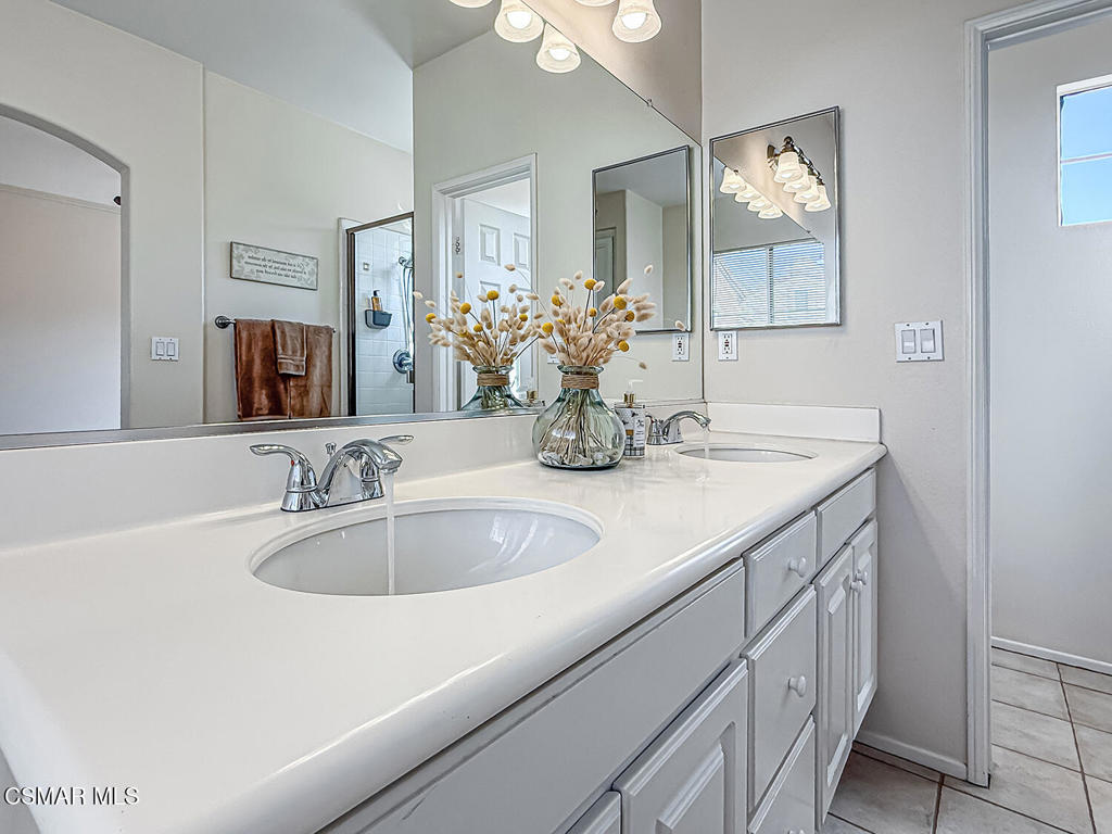 4030 Villamonte Court Camarillo, CA 93010 - Photo 31 of 42 a bathroom with sink and mirror