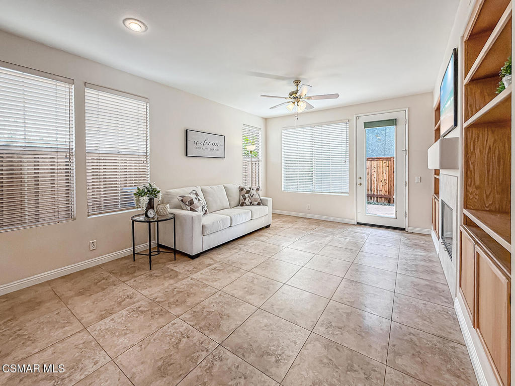 4030 Villamonte Court Camarillo, CA 93010 - Photo 10 of 42 a spacious bedroom with a large bed a chandelier and windows