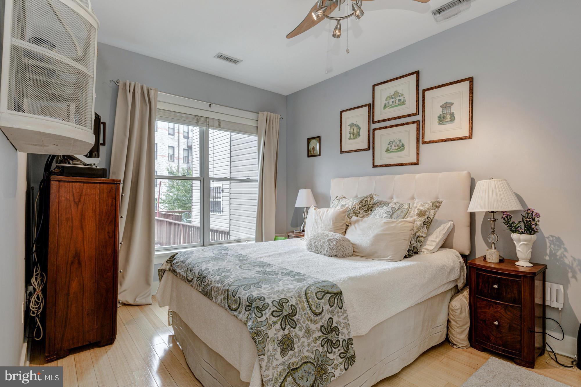 449 R Street Northwest, Unit 202 Washington, DC 20001 - Photo 8 of 16 a bedroom with bed and wooden floor