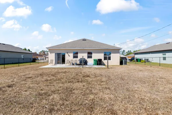 a view of a house with a yard and porch