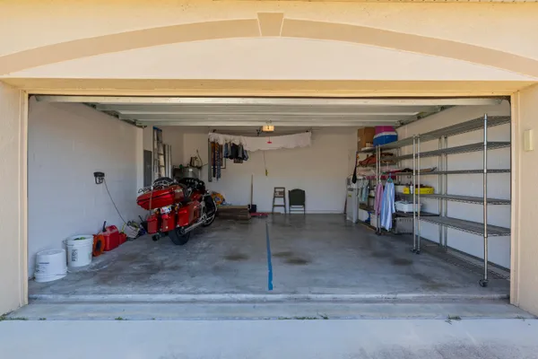 a view of a garage with clothes and shoes