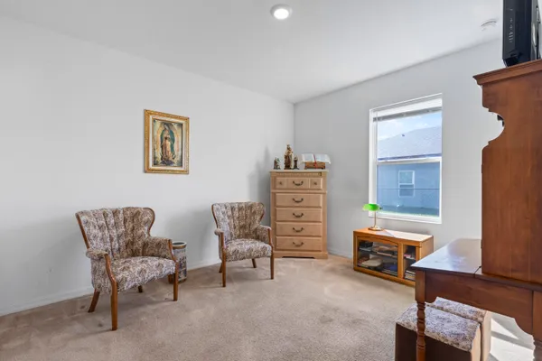 a bedroom with furniture and a closet