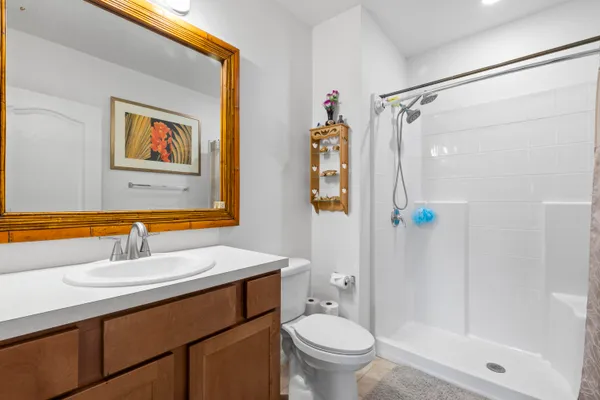 a bathroom with a sink toilet and shower