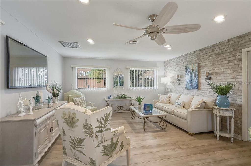 12577 Southwest Kings Row Lake Suzy, FL 34269 - Photo 11 of 56 a living room with furniture and a window