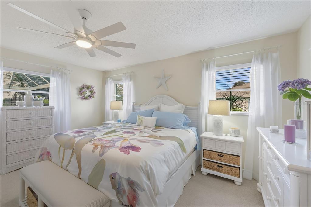 12577 Southwest Kings Row Lake Suzy, FL 34269 - Photo 25 of 56 a bedroom with a bed and a window