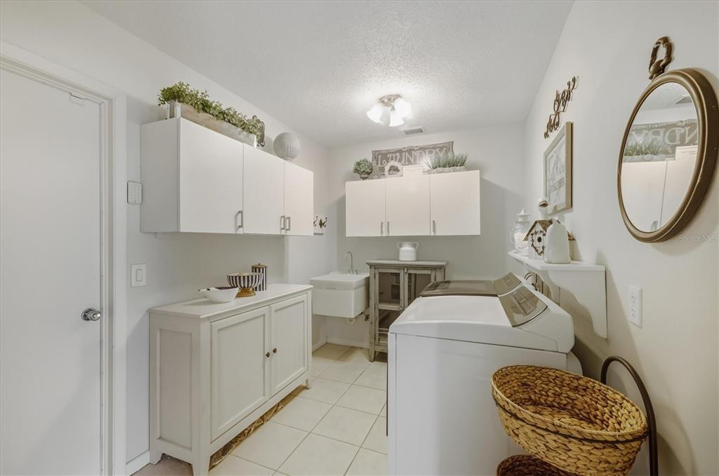 12577 Southwest Kings Row Lake Suzy, FL 34269 - Photo 34 of 56 a view of a kitchen with sink dryer and washer