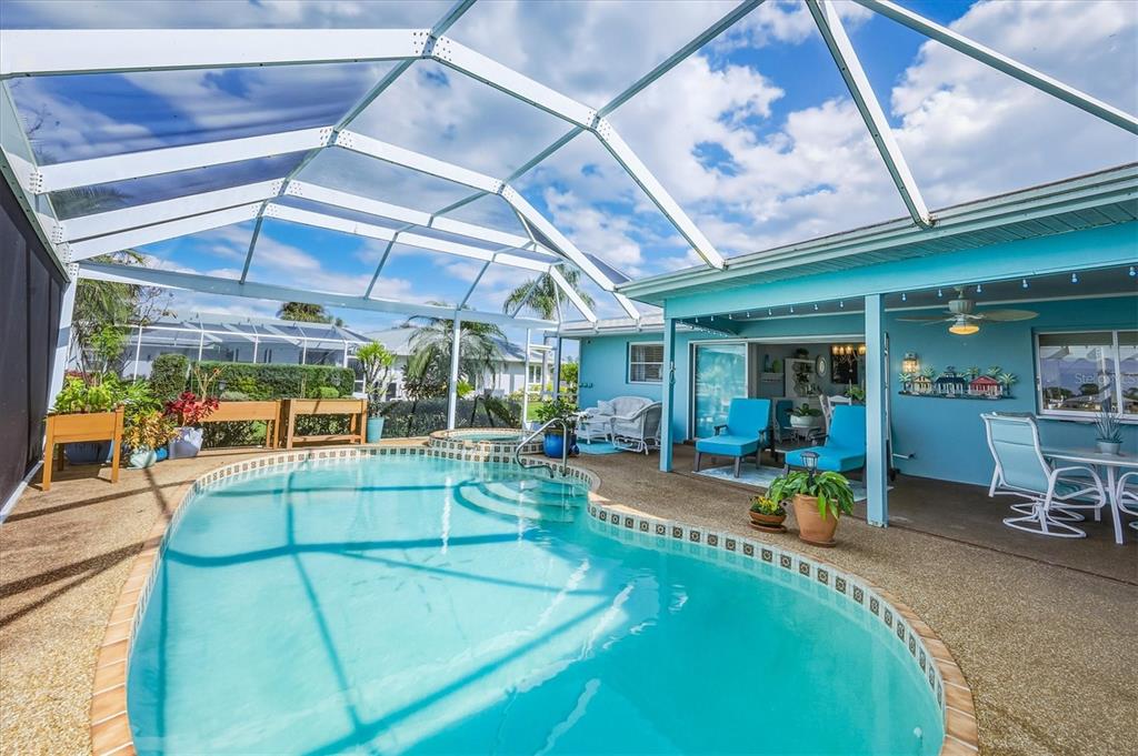 12577 Southwest Kings Row Lake Suzy, FL 34269 - Photo 39 of 56 a view of a swimming pool with a patio
