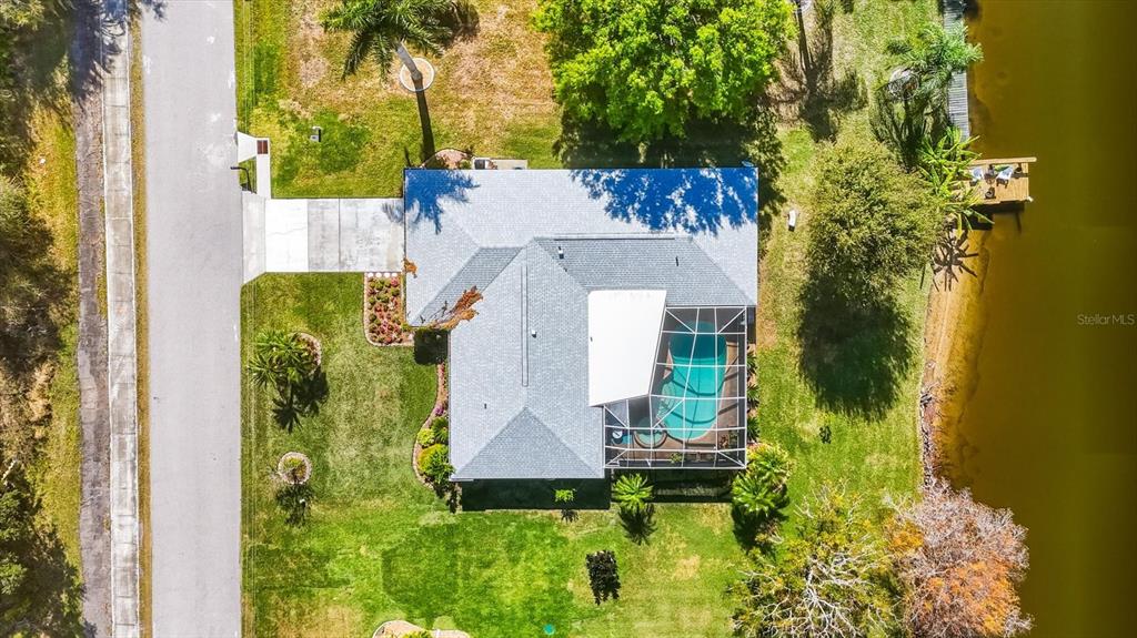 12577 Southwest Kings Row Lake Suzy, FL 34269 - Photo 49 of 56 an aerial view of a house with a garden