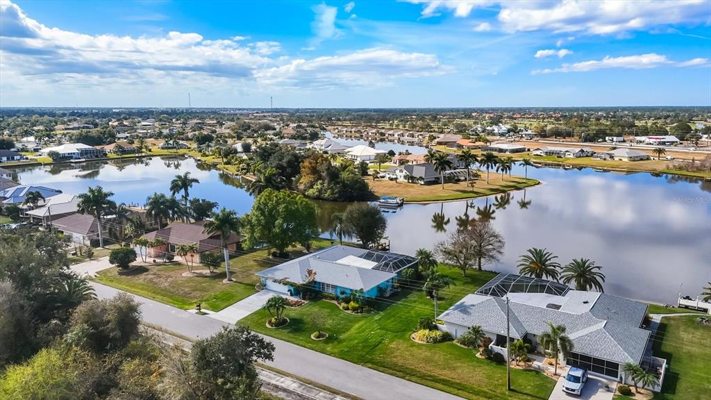 12577 Southwest Kings Row Lake Suzy, FL 34269 - Photo 56 of 56 an aerial view of residential houses with outdoor space