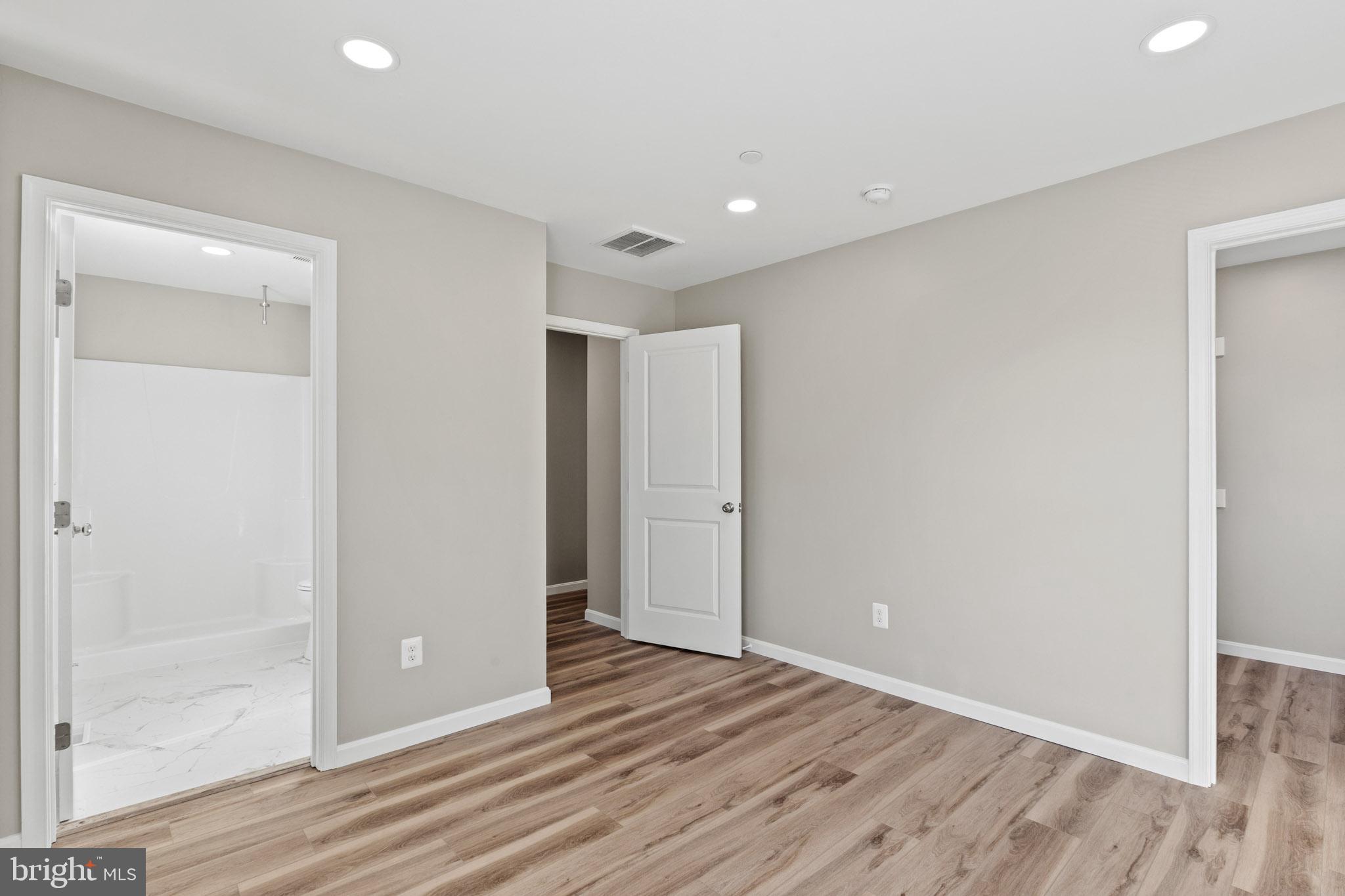 41577 Church Street Leonardtown, MD 20650 - Photo 21 of 25 a view of an empty room with wooden floor
