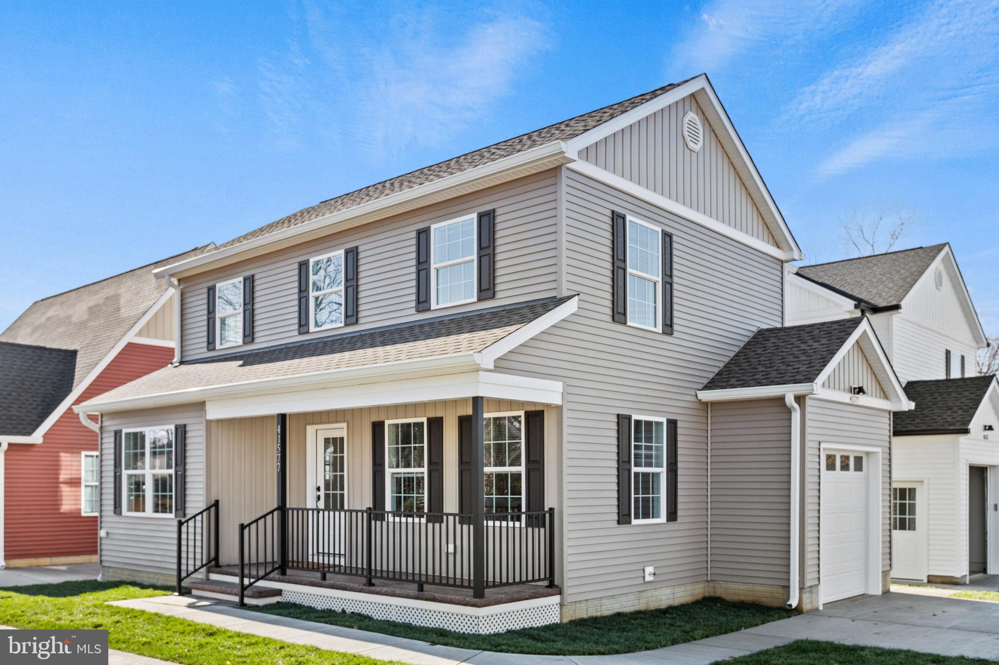 41577 Church Street Leonardtown, MD 20650 - Photo 3 of 25 a front view of a house with garden