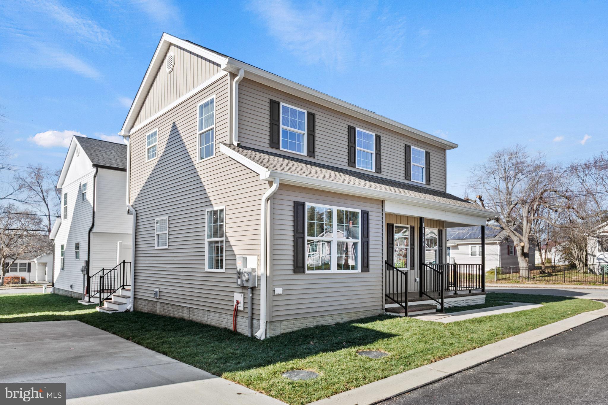 41577 Church Street Leonardtown, MD 20650 - Photo 5 of 25 a front view of a house with a yard