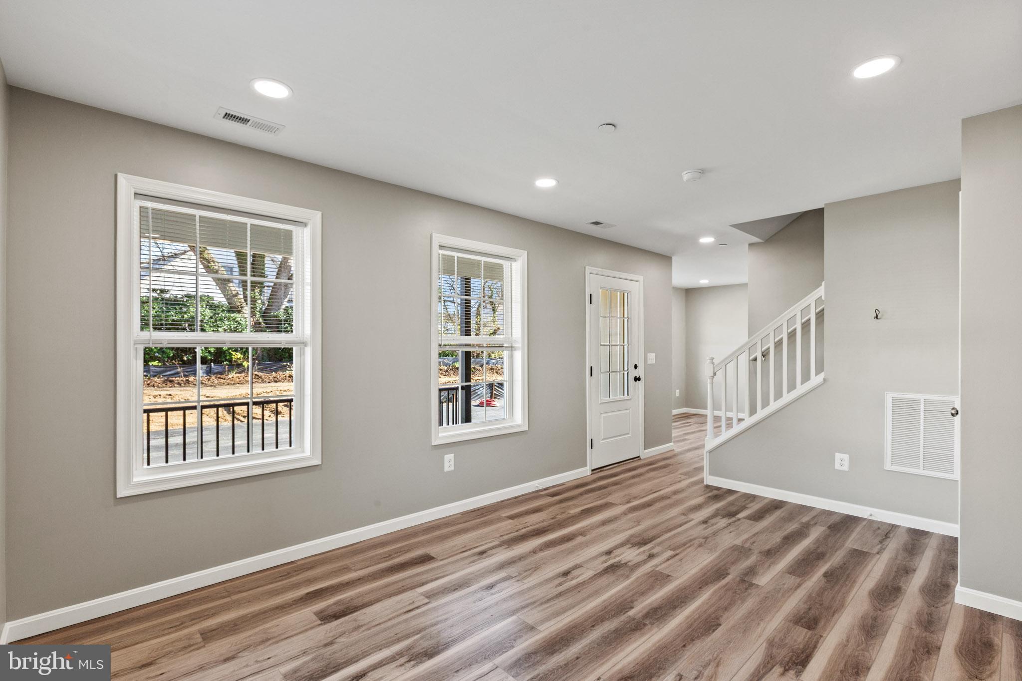 41577 Church Street Leonardtown, MD 20650 - Photo 7 of 25 a view of an empty room with wooden floor and a window
