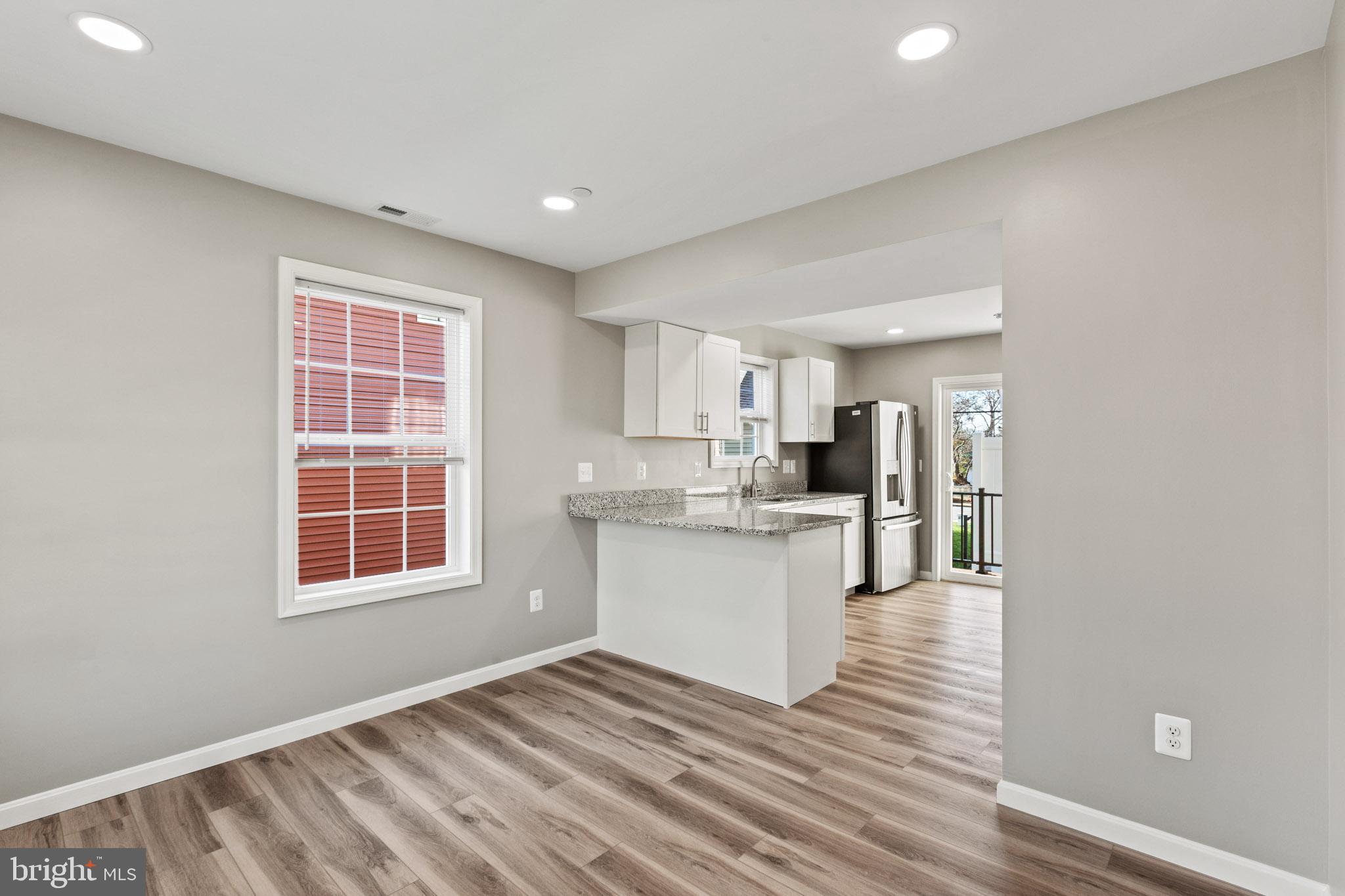 41577 Church Street Leonardtown, MD 20650 - Photo 8 of 25 a view of kitchen and wooden floor
