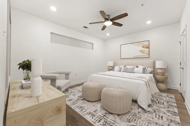 a bedroom with a bed and ceiling fan
