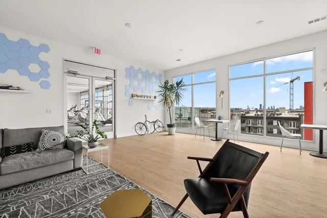 a living room with furniture and a rug