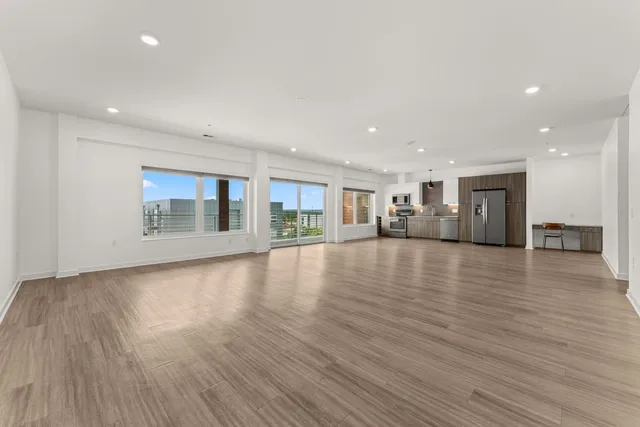 a view of a livingroom with furniture and wooden floor