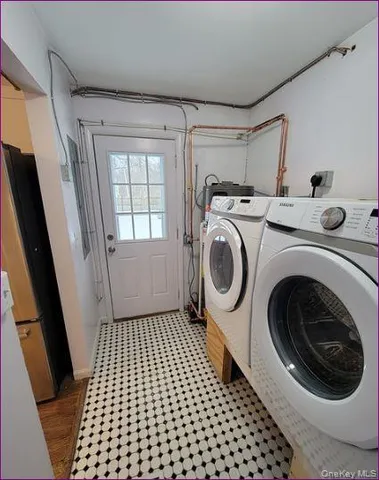 a utility room with dryer and washer