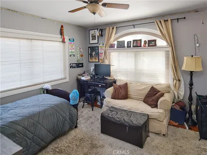 a living room with furniture and a window