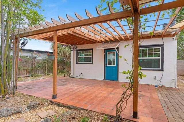 a front view of house with a potted plant