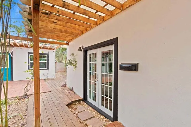 a view of a porch with wooden floor