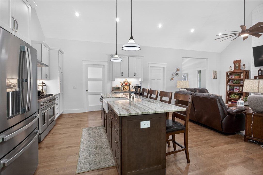 921 Falling Waters Lane Seneca, SC 29672 - Photo 14 of 46 Culinary excellence awaits in this open-concept kitchen featuring a spacious island with seating and modern appliances.