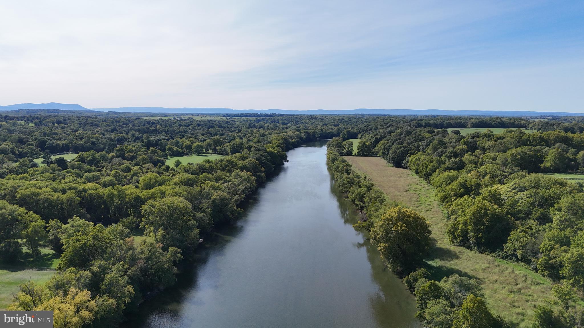 Lot 8-10 Howellsville Road Boyce, VA 22620 - Photo 22 of 42 a view of a lake with a mountain in the background