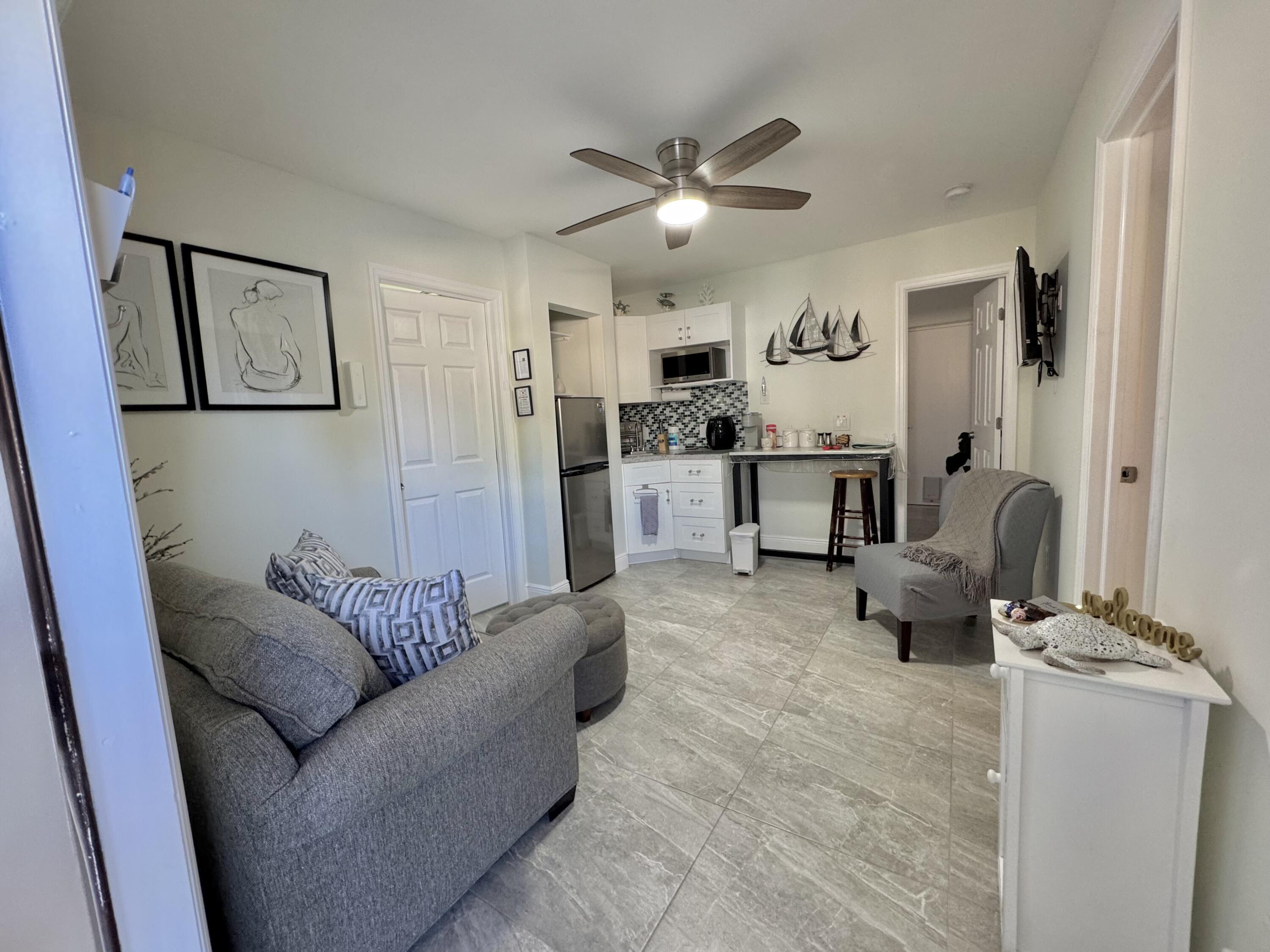 a living room with furniture and white walls
