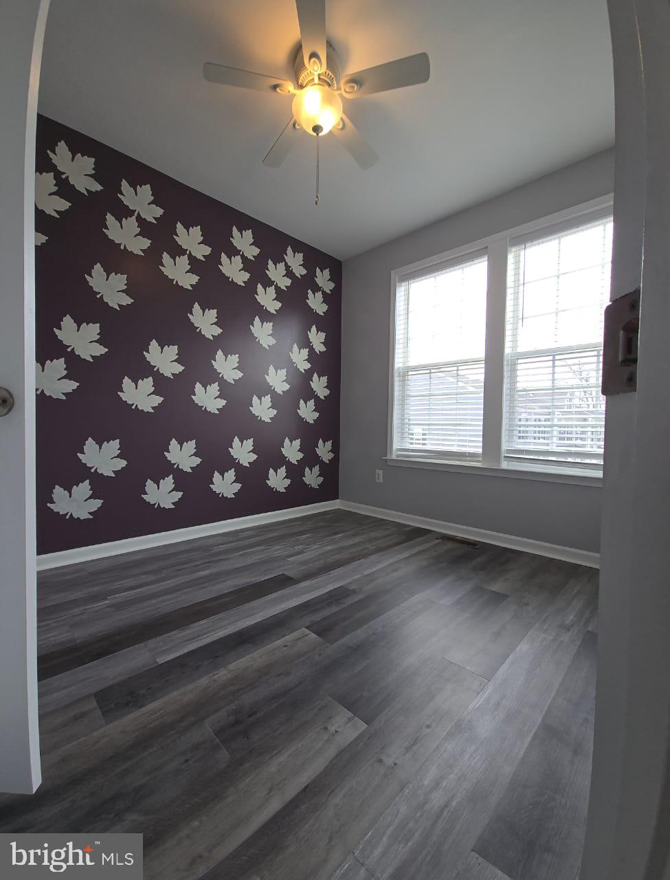 211 Spring Bank Avenue Frederick, MD 21701 - Photo 12 of 24 a view of empty room with window and chandelier fan