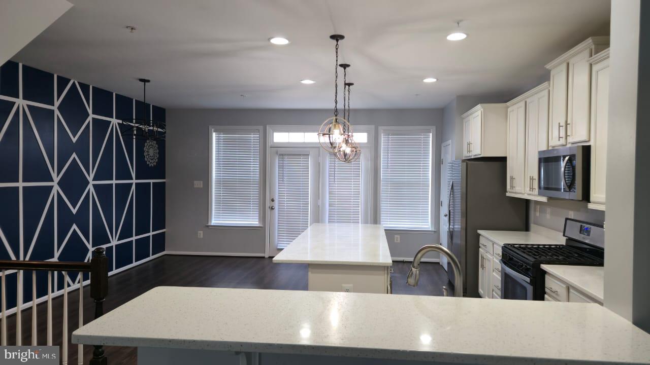 211 Spring Bank Avenue Frederick, MD 21701 - Photo 5 of 24 a kitchen with stainless steel appliances a refrigerator and a sink