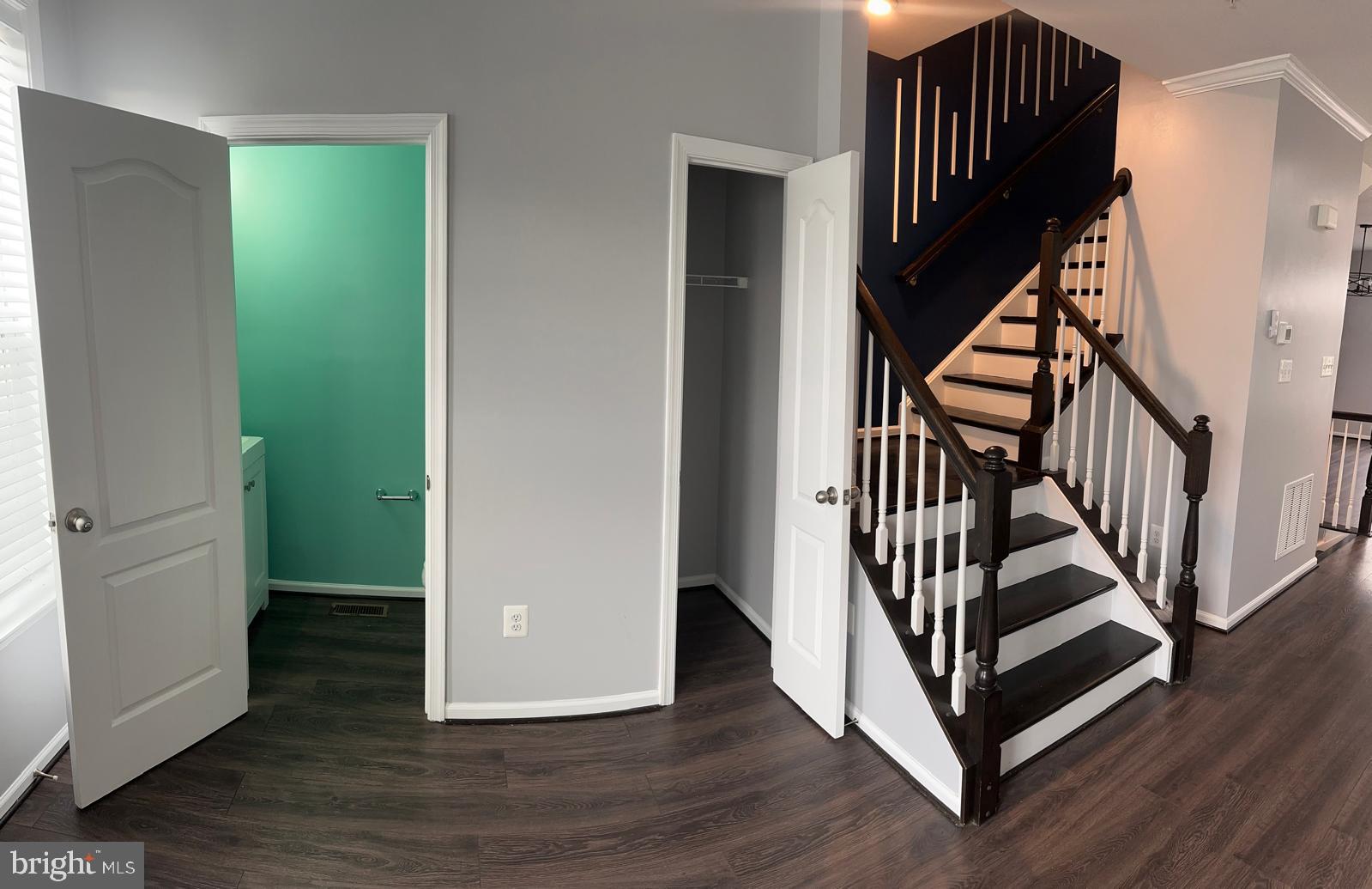 211 Spring Bank Avenue Frederick, MD 21701 - Photo 10 of 24 a view of a hallway with wooden floor and stairs