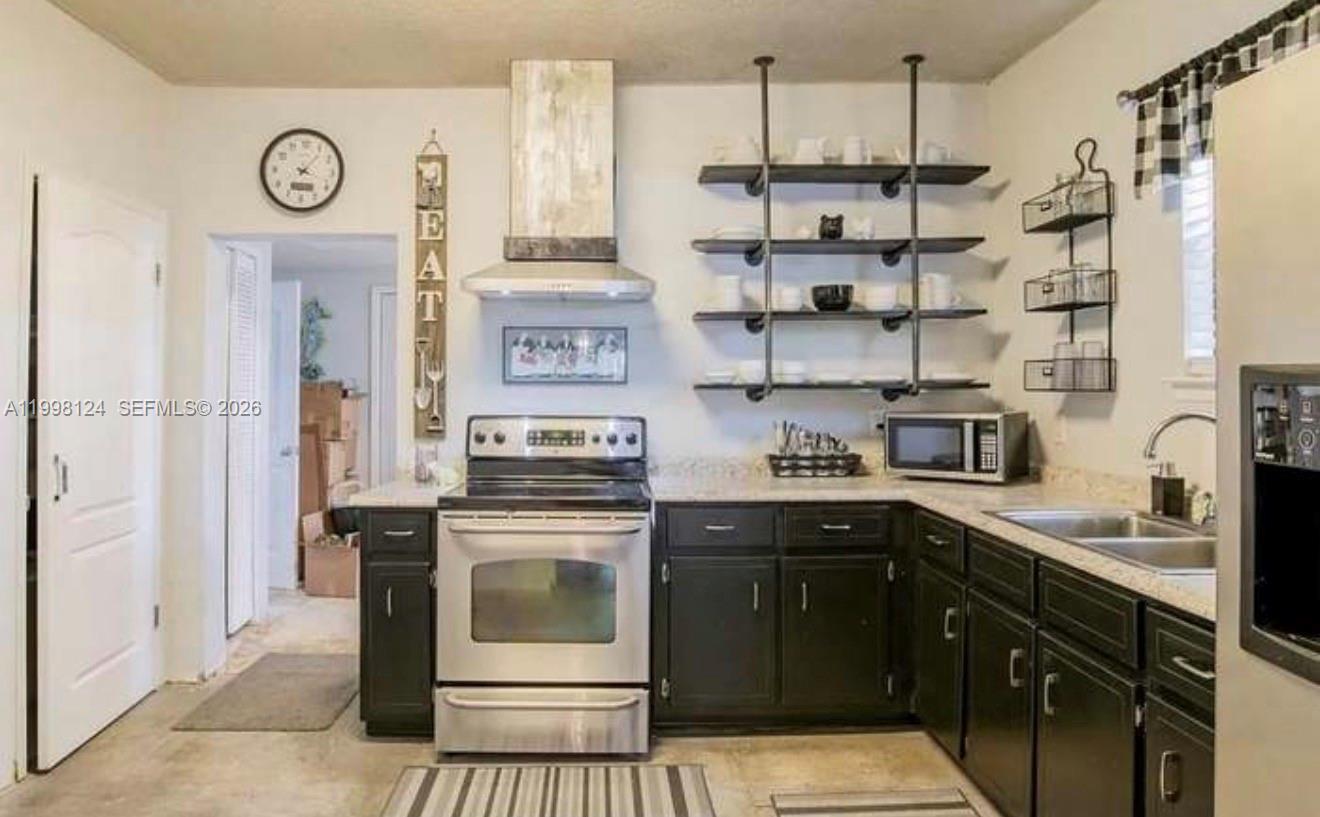1005 Lakewood Road Pensacola, FL 32507 - Photo 11 of 23 a kitchen with stainless steel appliances granite countertop a stove and a sink