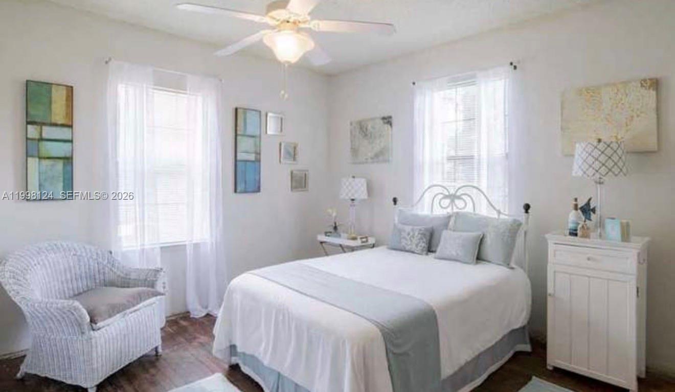 1005 Lakewood Road Pensacola, FL 32507 - Photo 15 of 23 a bedroom with a bed and a couch