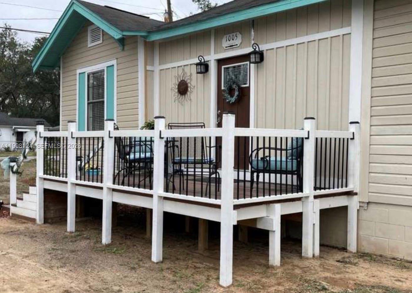 1005 Lakewood Road Pensacola, FL 32507 - Photo 21 of 23 a view of a house with a porch and furniture