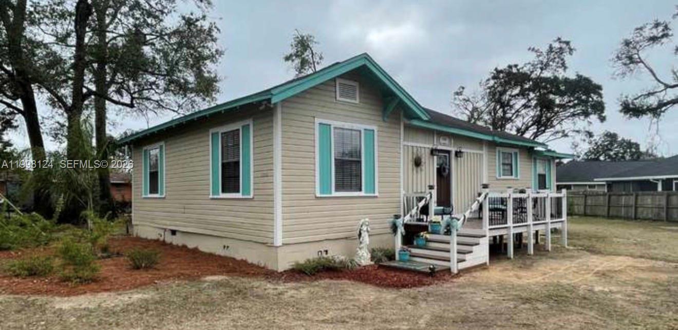1005 Lakewood Road Pensacola, FL 32507 - Photo 23 of 23 a view of house with a yard and sitting area