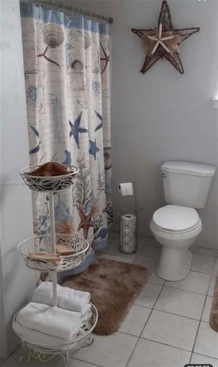 1005 Lakewood Road Pensacola, FL 32507 - Photo 4 of 23 a bathroom with a toilet and a shower
