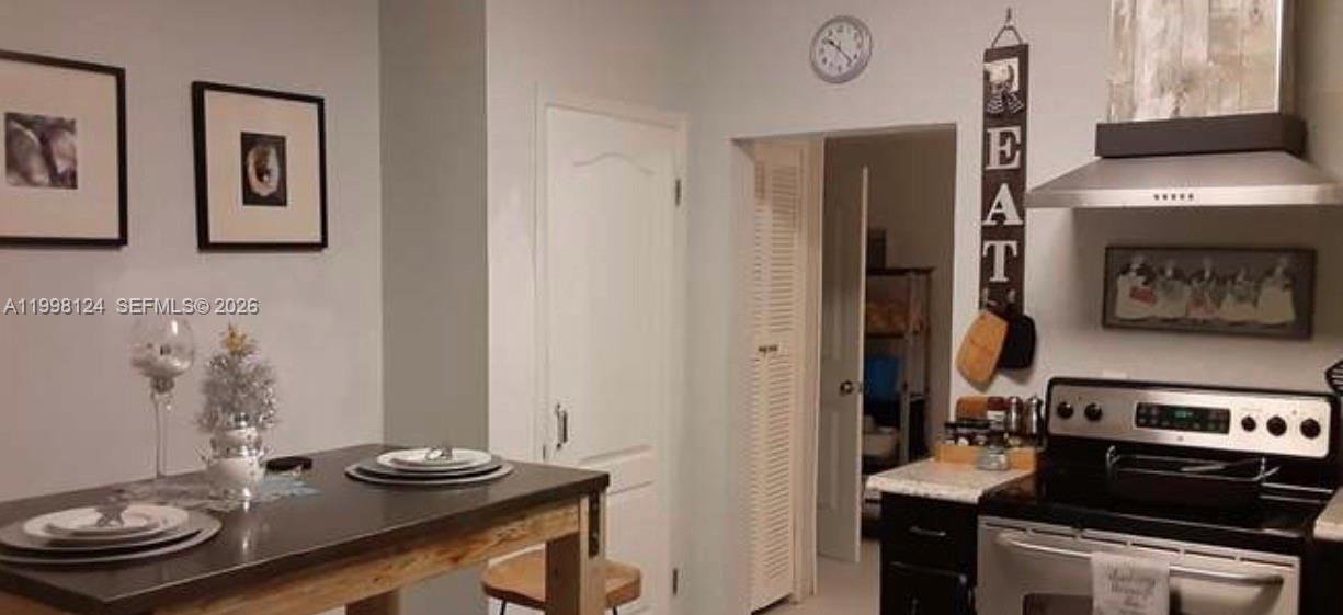 1005 Lakewood Road Pensacola, FL 32507 - Photo 7 of 23 a kitchen with a refrigerator and stove