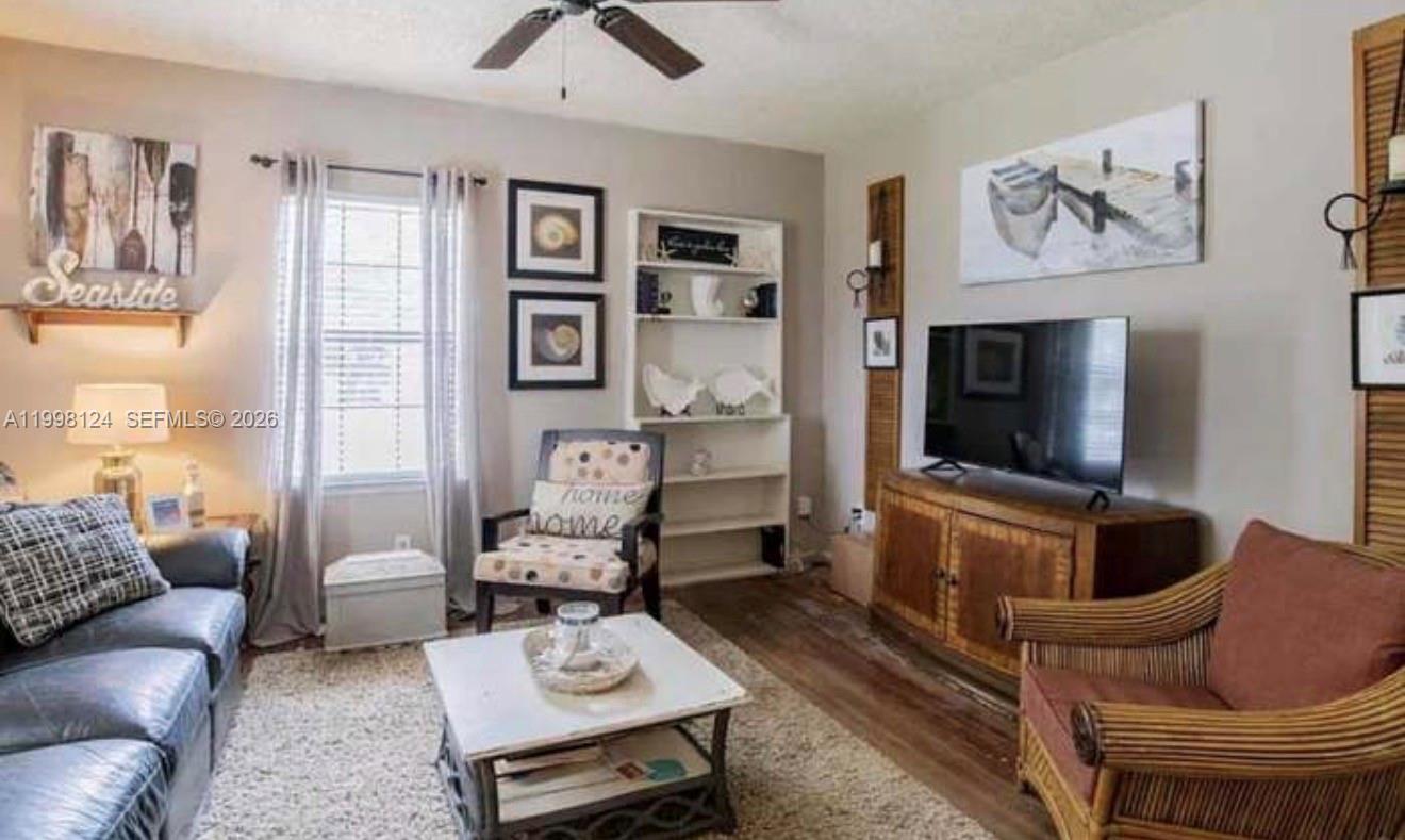 1005 Lakewood Road Pensacola, FL 32507 - Photo 8 of 23 a living room with furniture and a flat screen tv