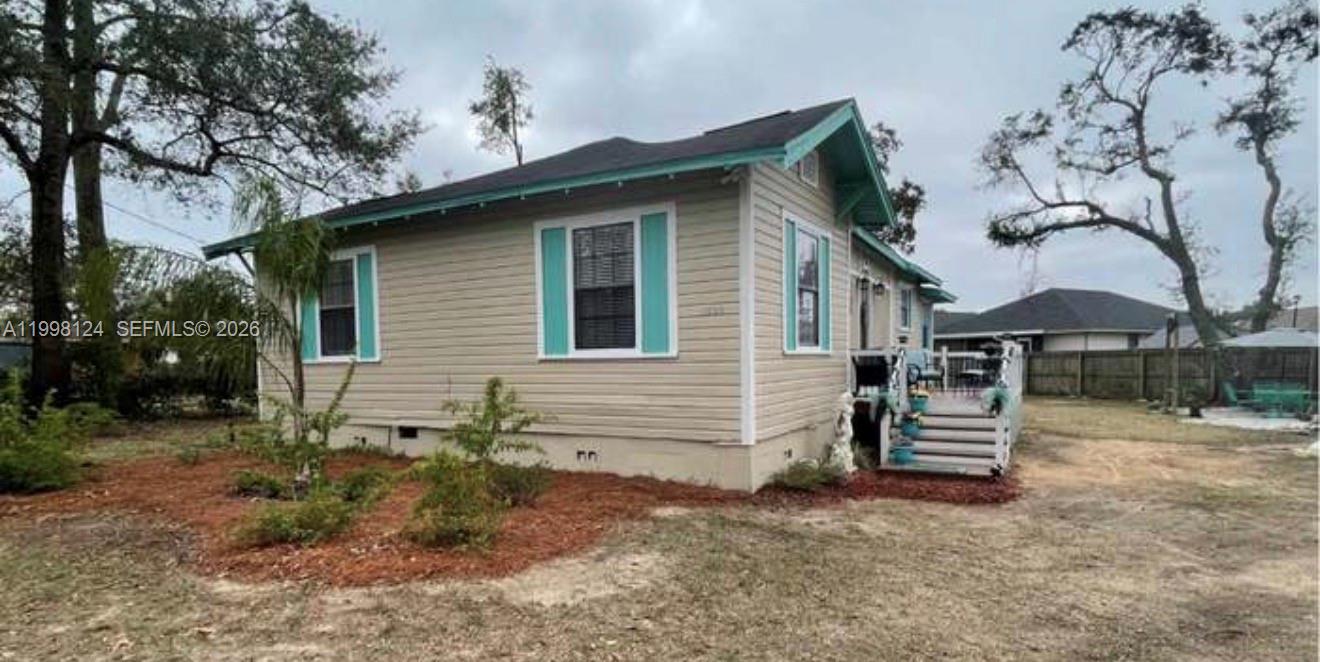 1005 Lakewood Road Pensacola, FL 32507 - Photo 10 of 23 a view of a house with a yard