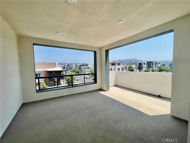 a view of a room with a large window