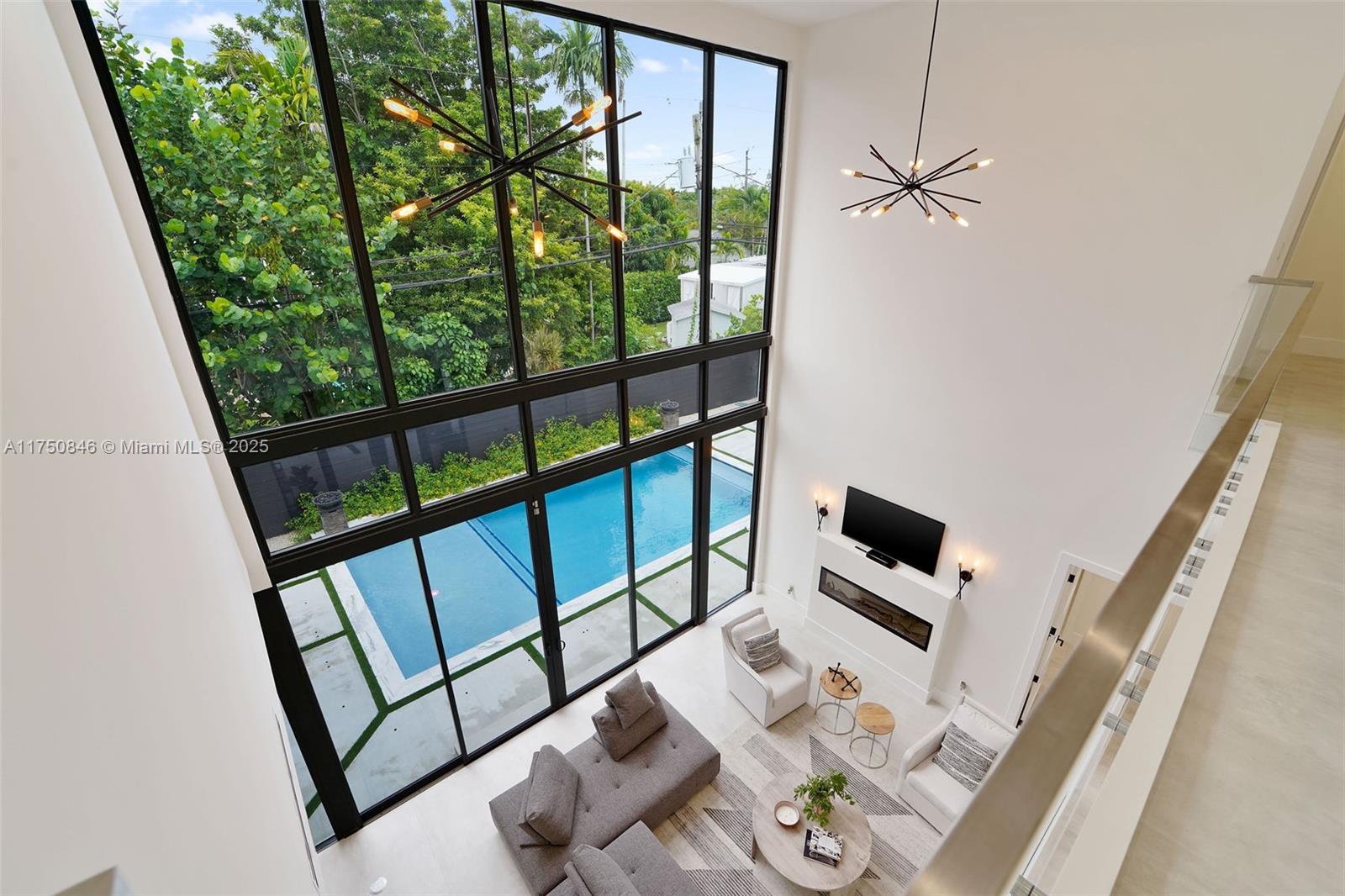 4321 Southwest 11th Street Miami, FL 33134 - Photo 16 of 43 Soaring ceilings with views into the living room and pool deck