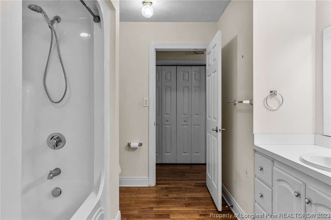 100 Carolyns Mill Place Rockingham, NC 28379 - Photo 13 of 30 a bathroom with a shower a sink and a mirror