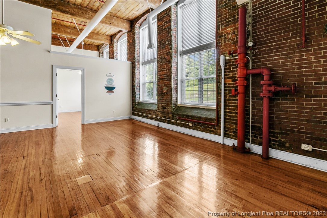 100 Carolyns Mill Place Rockingham, NC 28379 - Photo 15 of 30 a view of a room with wooden floor and windows
