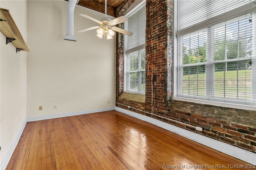 100 Carolyns Mill Place Rockingham, NC 28379 - Photo 19 of 30 a view of a room with wooden floor and windows