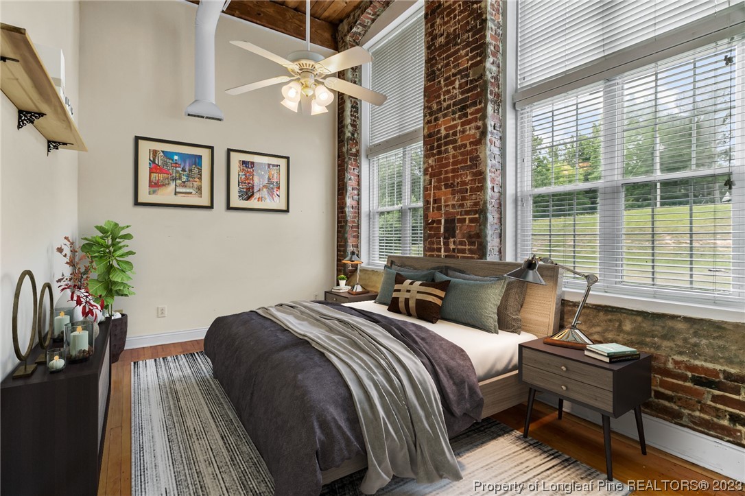 100 Carolyns Mill Place Rockingham, NC 28379 - Photo 20 of 30 a bedroom with a bed table and a large window